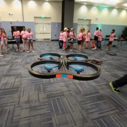Photo from the 2016 GenCyber Camp of participants flying drones.