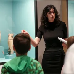 Jessica Tomkins, a past W. Benson Harer Egyptology Scholar in Residence at CSUSB, showing young students some of the Ancient Egypt collection at the university’s Robert and Frances Fullerton Museum of Art.