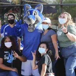 CSUSB's Homecoming Bash attendees with Cody Coyote
