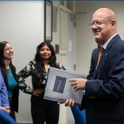 Tomás Gómez-Arias (at right), dean of CSUSB’s Jack H. Brown College of Business & Public Administration, meets with students enrolled in the university’s master’s in human resources program.