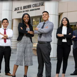 Group of students in front of Jack H. Brown College of Business and Public Administration building.