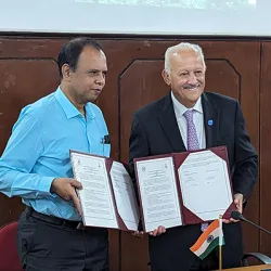 From left, R. Sridhar, vice principal of Madras Christian College's principal, and Tomás D. Morales, president of CSUSB, hold signed copies of a memorandum of understanding for academic exchange between the two higher education institution.