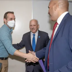 Jeremy Murray (left), professor of history, is congratulated by university president Tomás D. Morales (center) and Provost Rafik Mohamed upon being named the recipient of the 2022-23 Outstanding Service Award.