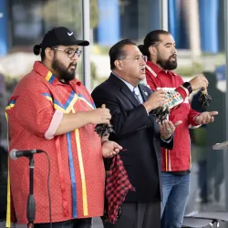 James C. Ramos (center) leading a traditional song at the closing event.