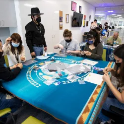 First Peoples’ Center student assistant Daniel Calderon, Guachichil Nation (standing), with students at the center, located in the university’s Santos Manuel Student Union North. 