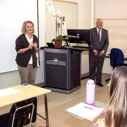 President Tomás Morales surprises Lacey Kendall with the 2023 Outstanding Lecturer Award