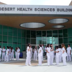 Nursing students gather in front of the Palm Desert Health Sciences Building at the Palm Desert Campus