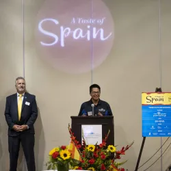 Student speaking at “A Taste of Spain” event.
