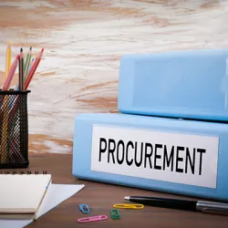 Procurement binder on a desk.