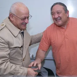 Image of President Morales congratulating Stuart Sumida
