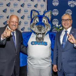 From left, CSUSB President Tomás D. Morales, CSUSB mascot Cody the Coyote, and Rialto Unified School District Superintendent Cuauhtémoc Avila. CSUSB and RUSD formally signed a memorandum of understanding that launched Teach Rialto.