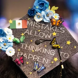 A decorated graduation cap at commencement 