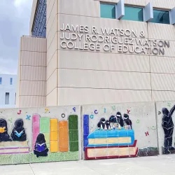 Part of the mural “Eternal Learning” in front of the James R. Watson and Judy Rodriguez Watson College of Education.