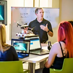 Tony Coulson, executive director of the CSUSB Cybersecurity Center, with some of his students. The National Security Agency selected the university to be a leader of its core workforce development initiative.