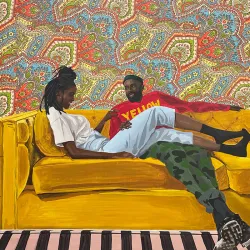 Corey Pemberton’s “Yellow,” showing a man and woman relaxing on a yellow couch.