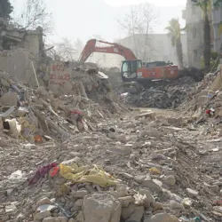 A rescue team is using a bulldozer to remove the rubbles in Antakya