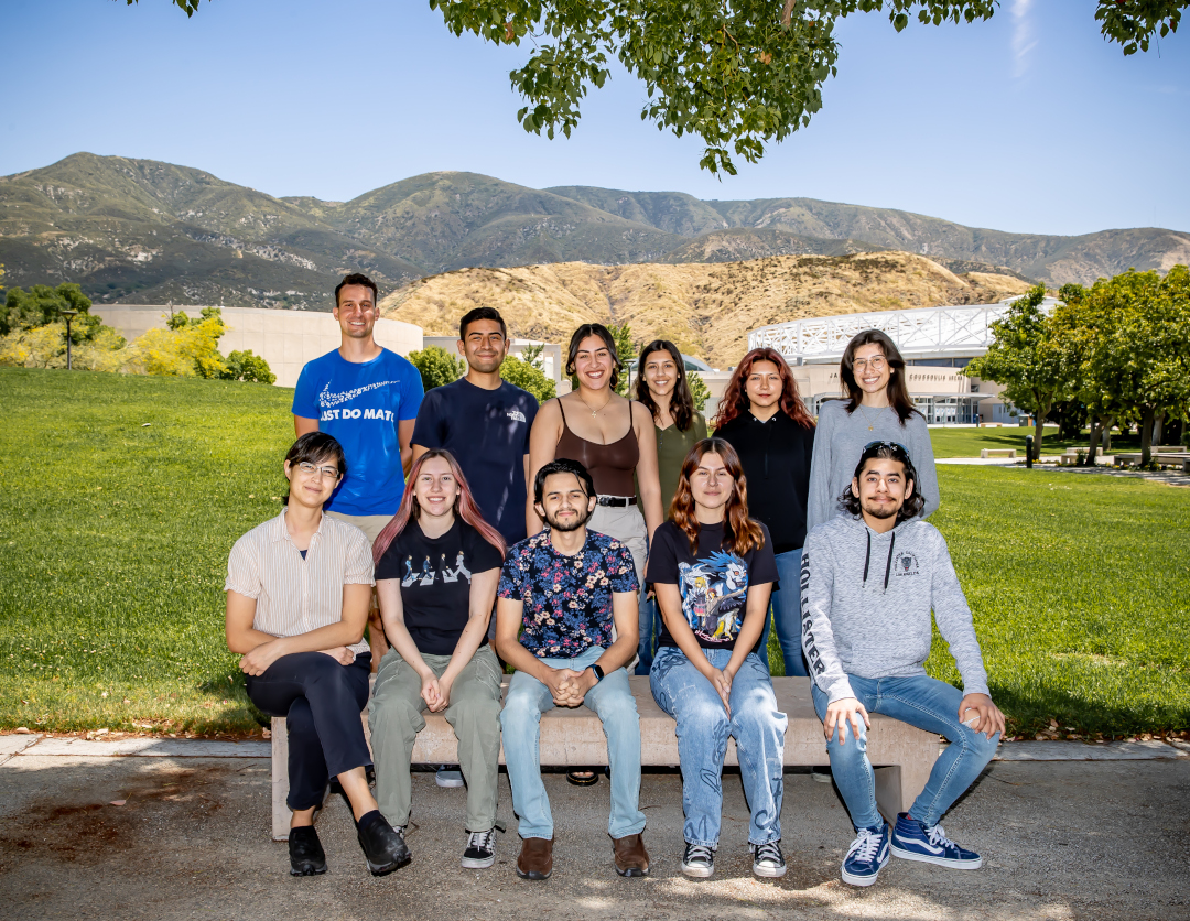 people sitting in front of mountains