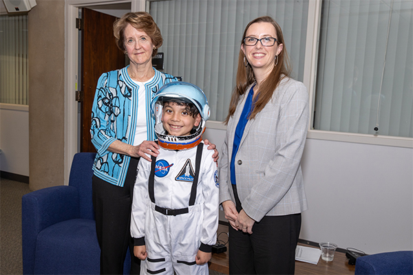 Kathryn C. Thornton with a young NASA fan.