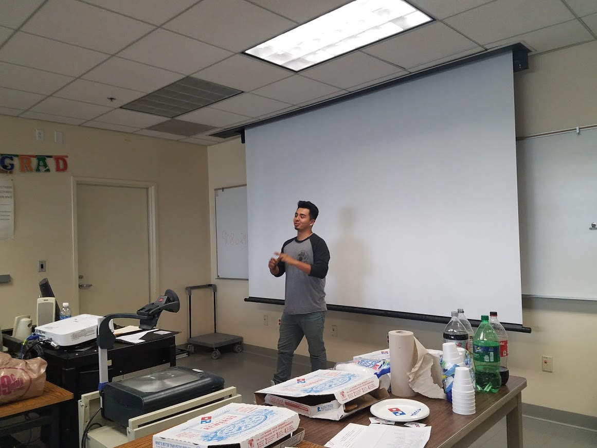 Guy Standing in Front of Classroom