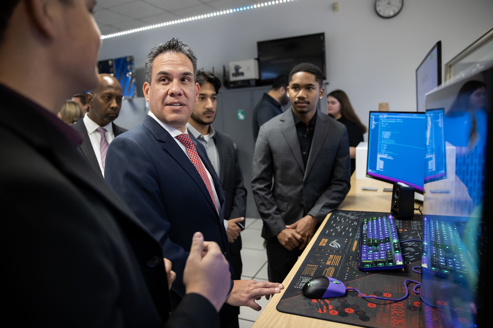 U.S. Rep. Pete Aguilar talks with students about on some of the work done at the CSUSB Cybersecurity Center.