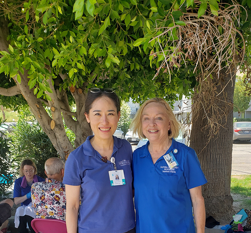 Kim, left, credits several CSUSB nursing faculty members for helping her along her educational journey, including Diane Vines, right, director of the CSUSB Nursing Street Medicine program. 
