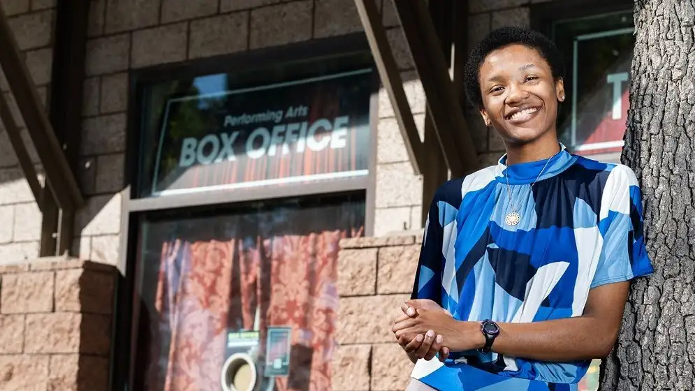 Dea Armstrong standing in front of the Performing Arts Box Office
