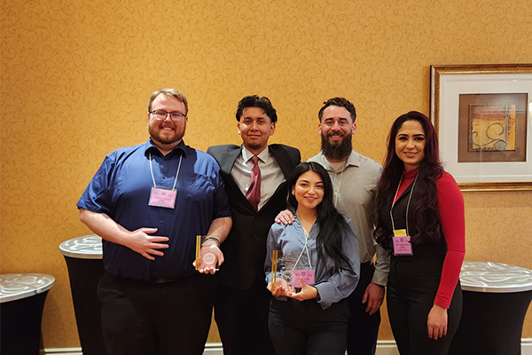The JHBC undergraduate team, from left to right, Jeremy Stewart, Ivan Herrera-Valentin, Janet Arias (with award), Ryan Valenzuela and Jessica Pulido Rodriguez.