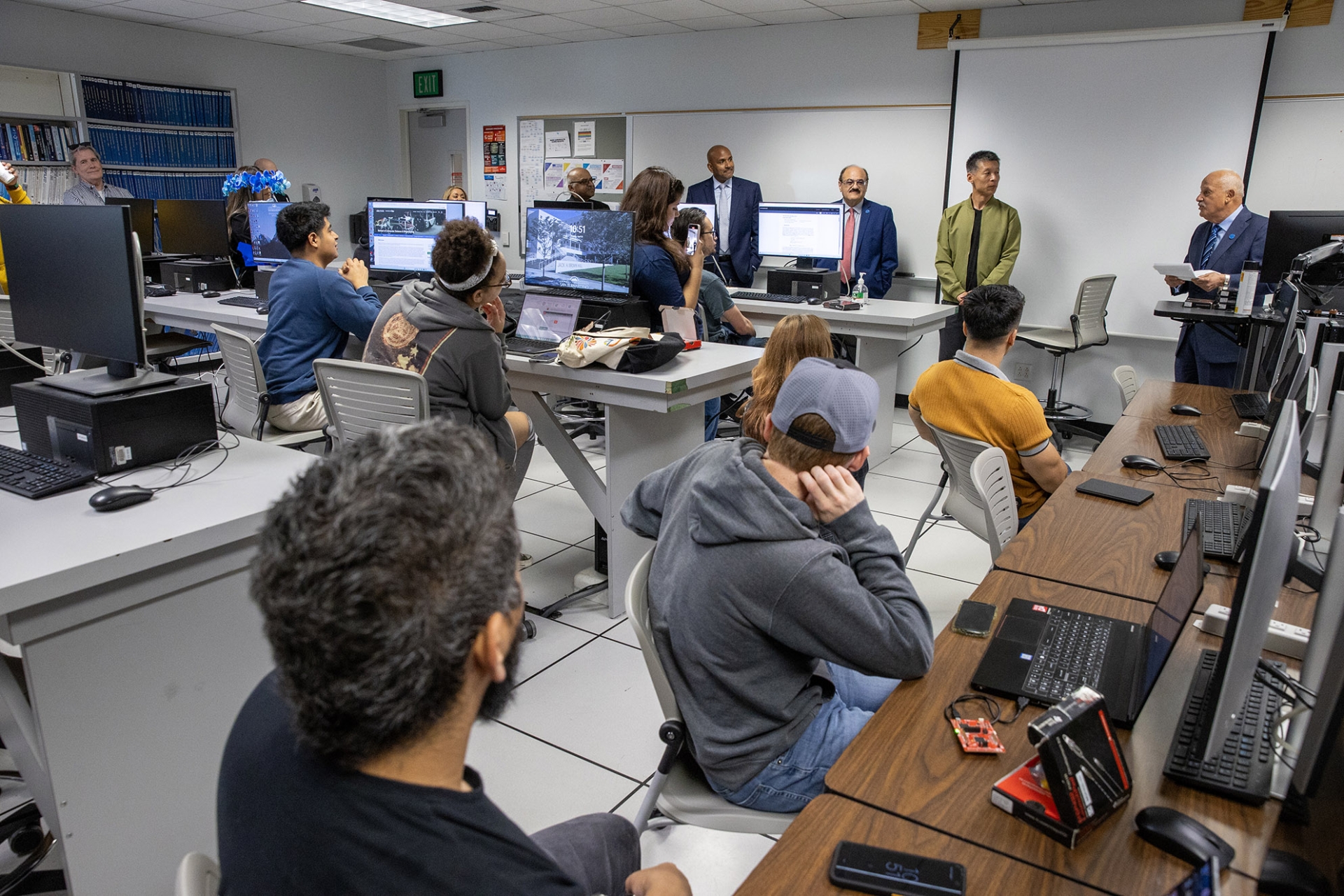 Students, faculty and administrators look on as CSUSB President Tomás D. Morales announces that Qingquan Sun, professor in the School of Computer Science and Engineering, is the recipient of the university’s 2023-24 Outstanding Scholarship, Research and Creative Activities Award.