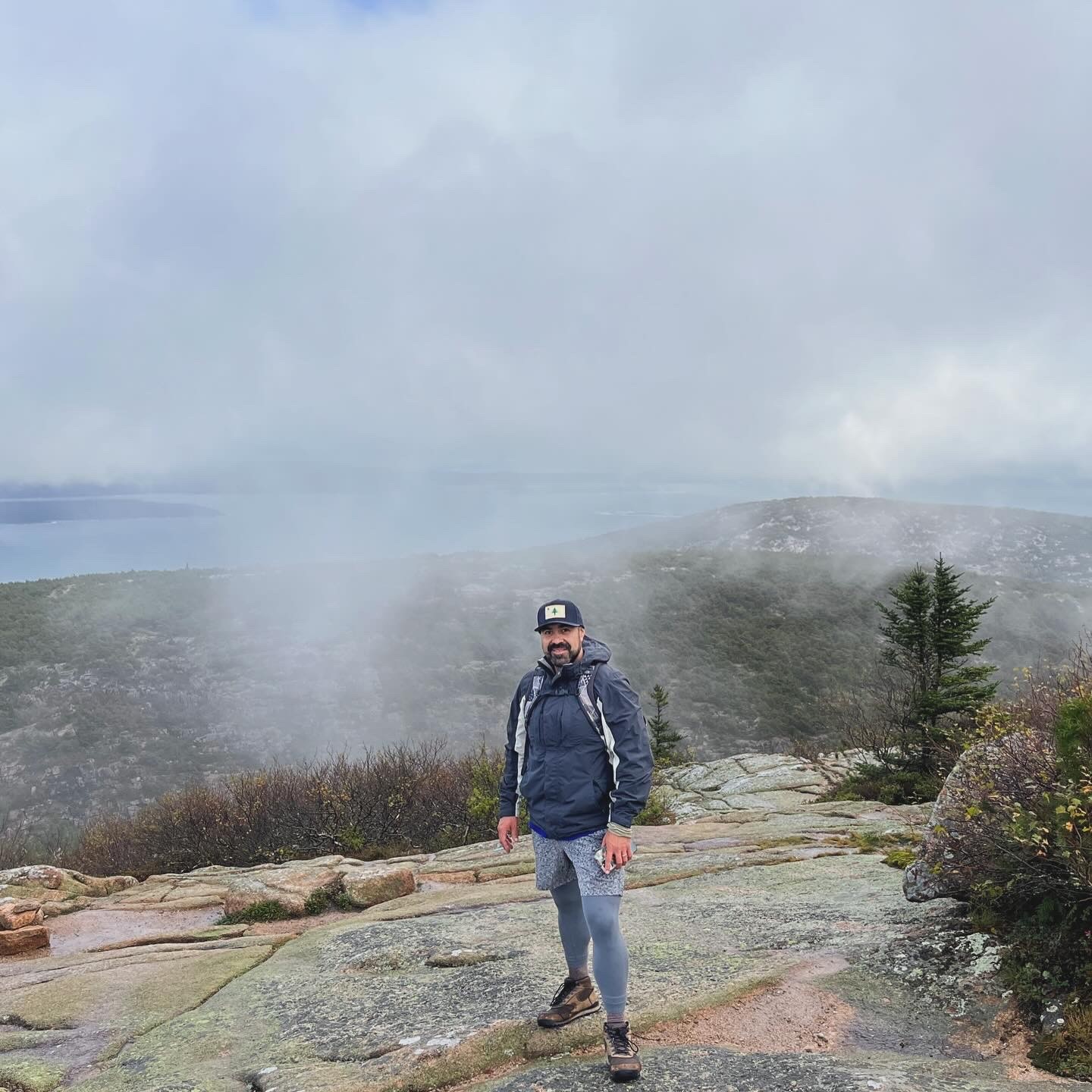 Daniel Gascon standing on a mountain top