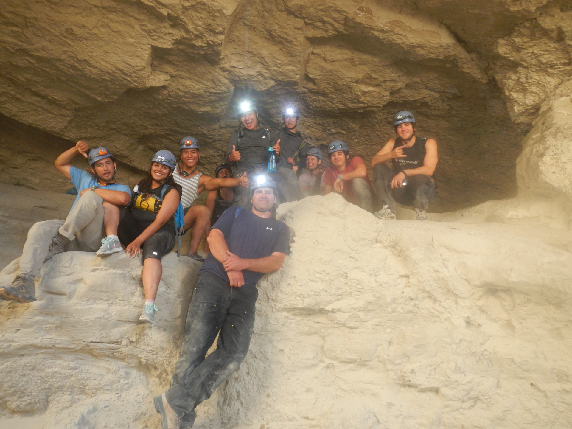 group posing in cave