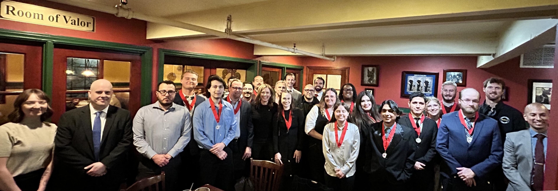 Members of CSUSB's political science honor society gathered in a dining area.