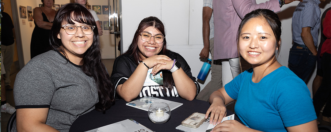 Visitors sitting around a table during an event