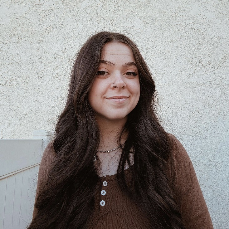 Image of a female smiling at camera.