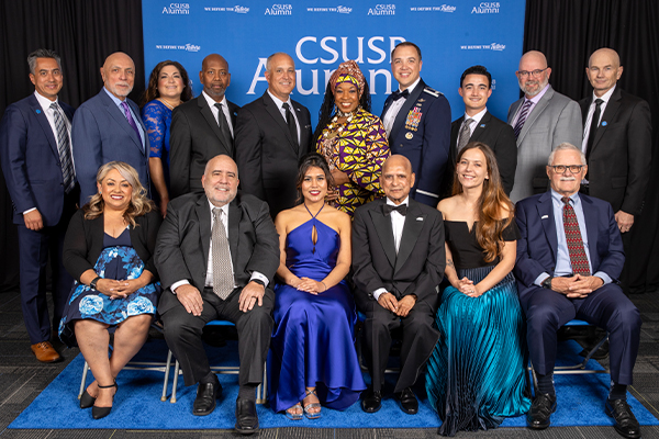 Dr. Appannagari “Dev” GnanaDev (front, third from right) received the Distinguished Alumni Award, Mirna Orihuela (front, third from left) received the Emerging Leader Award, and Roderick Hendry (front, second from left) received the Coyote Spirit Award. Paw Print Awards were presented to Lt. Col. Jeffrey S. Lehmkuhl (back, fourth from right), Kathleen E. Elison (front, second from right), ValLimar Jansen (back, fifth from right), Mauricio V. Arellano (back, fifth from left), and Wayne M. Harp (front, far right).