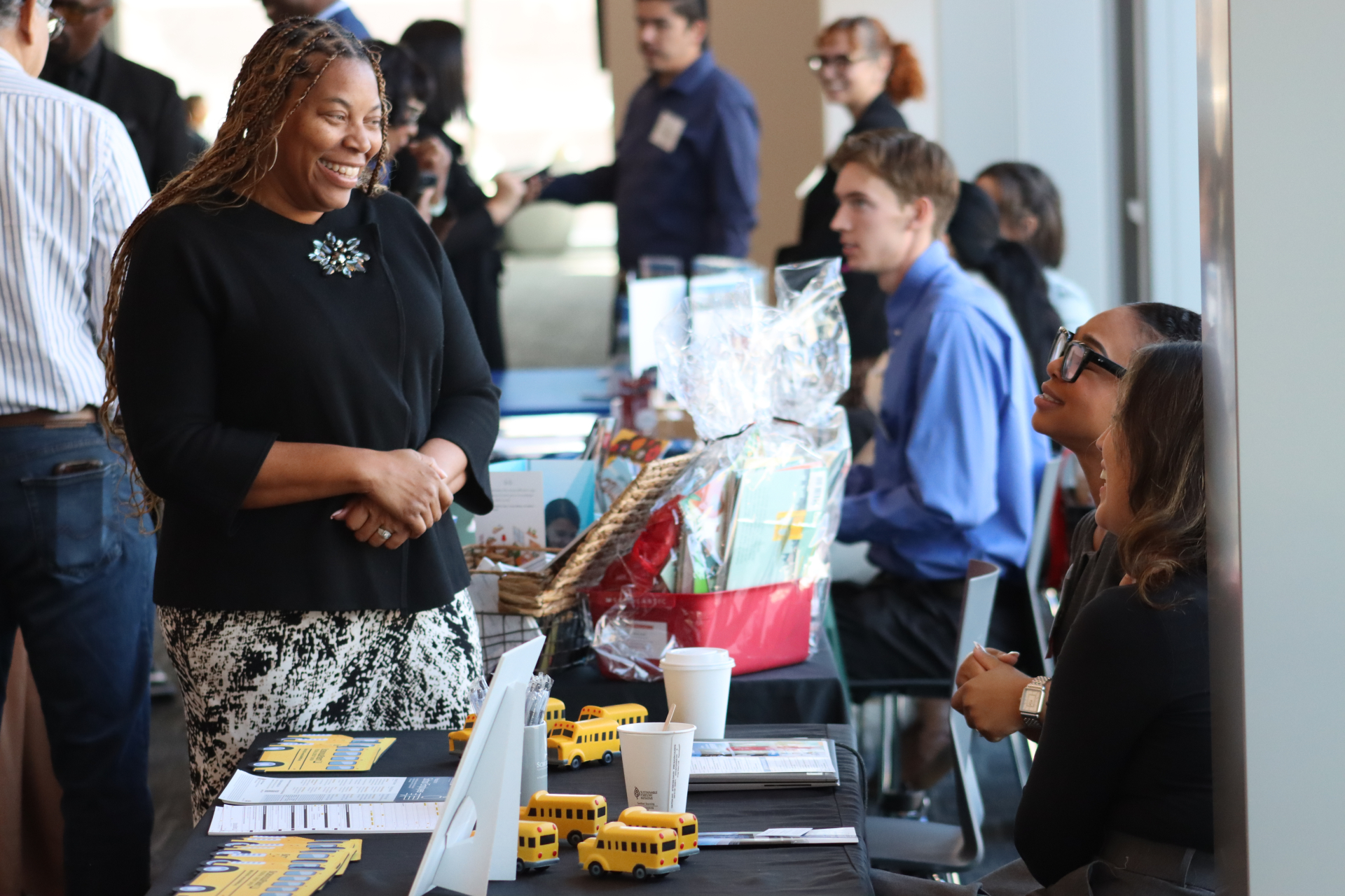Picture of attendees talking with sponsors