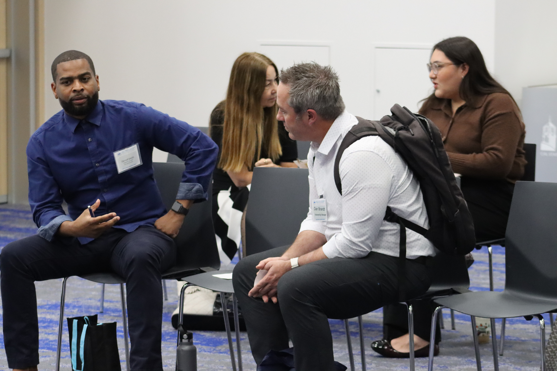 Photo of four people talking during breakouts
