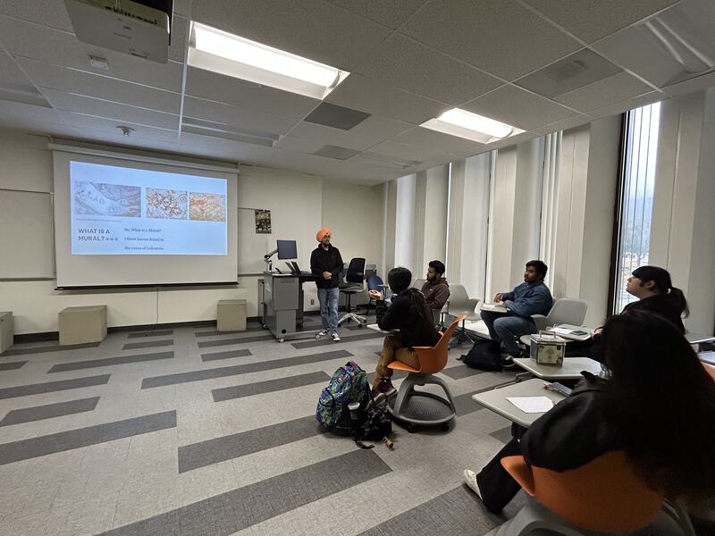 G giving a presentation on Murals