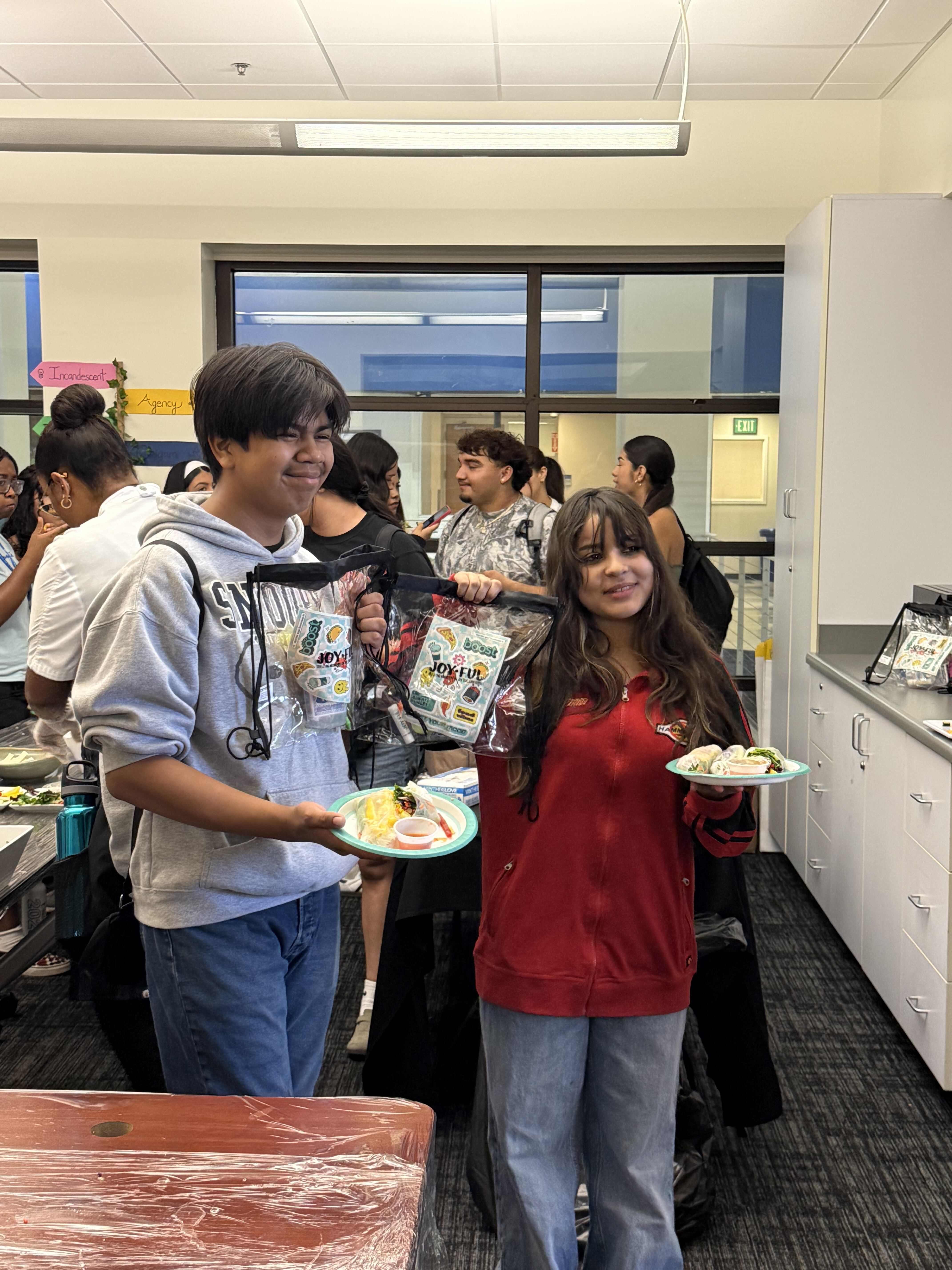 Students learning how to make spring rolls