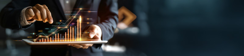 Businessperson holding tablet with virtual finance data