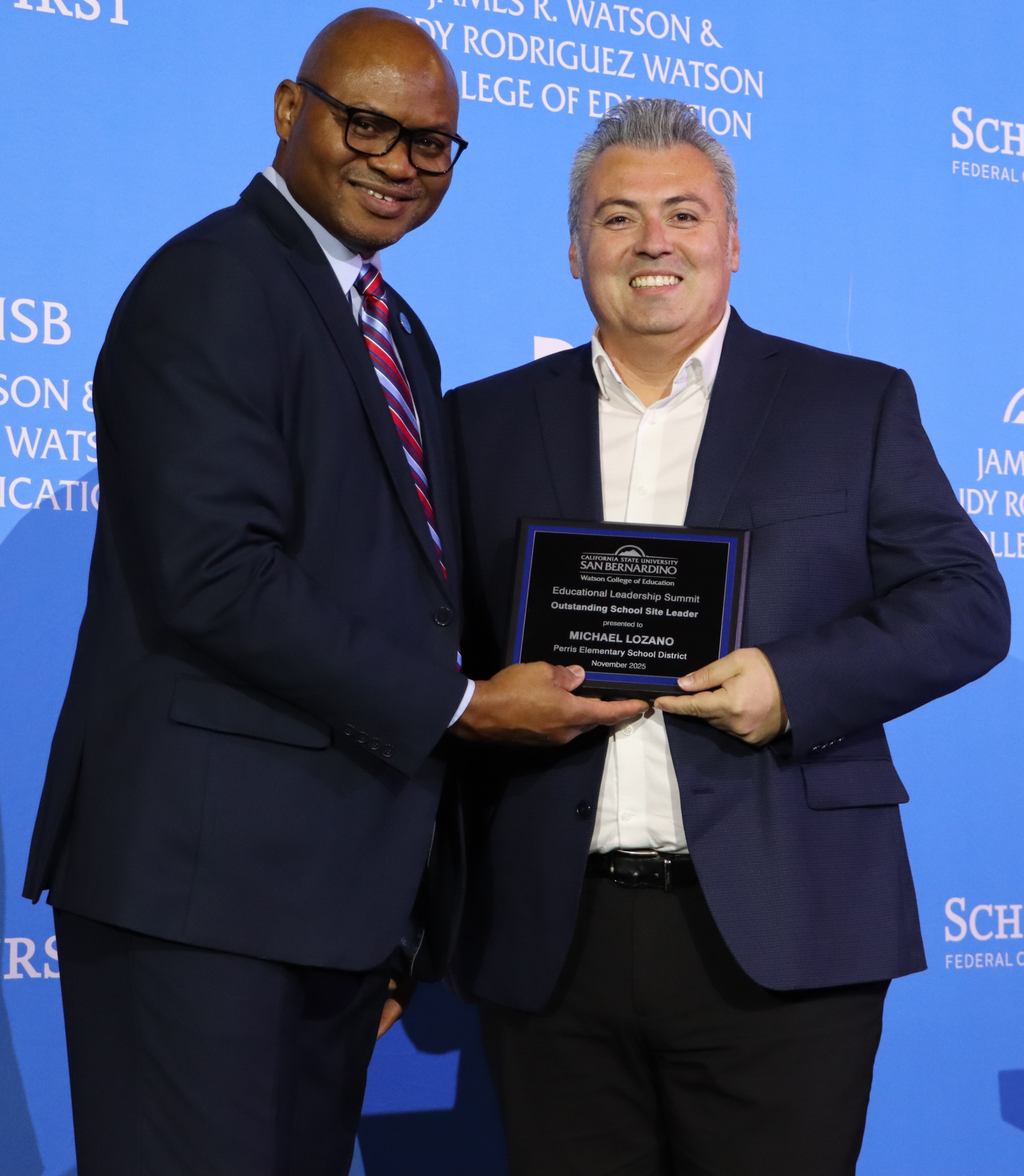 Photo of Michael Lozano receiving an award