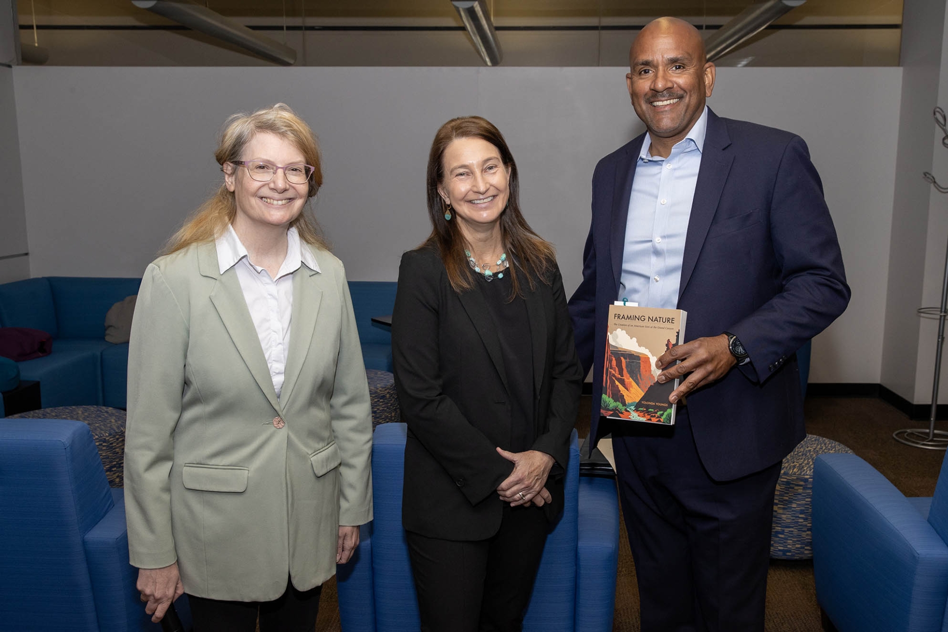 From left, Rebecca Lubas, dean of the CSUSB Libraries, Yolonda Youngs and Provost Rafik Mohamed, holding a copy of Youngs’ book, Framing Nature: The Creation of an American Icon at the Grand Canyon.”>>