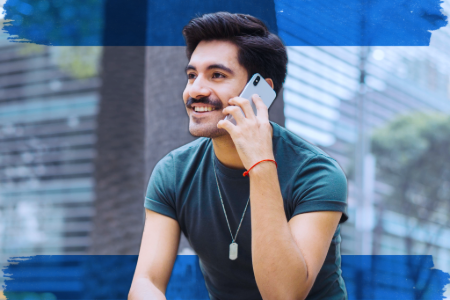 2. A man speaking on a cell phone, appearing engaged in a discussion.
