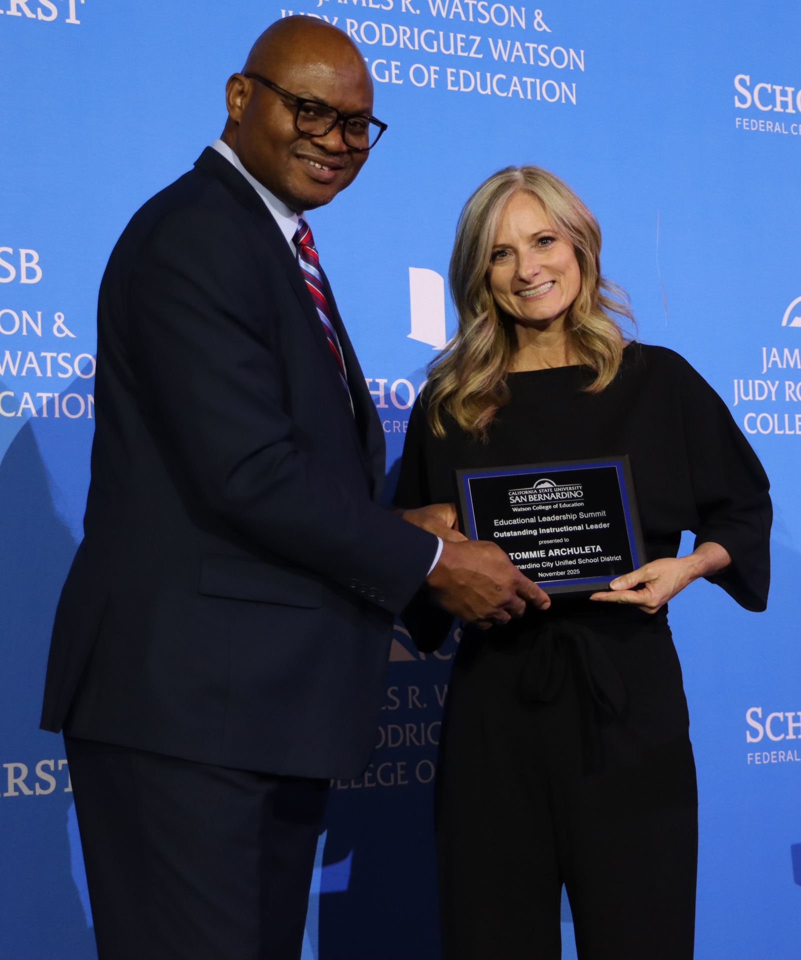 Photo of Tommie Archuleta receiving an award