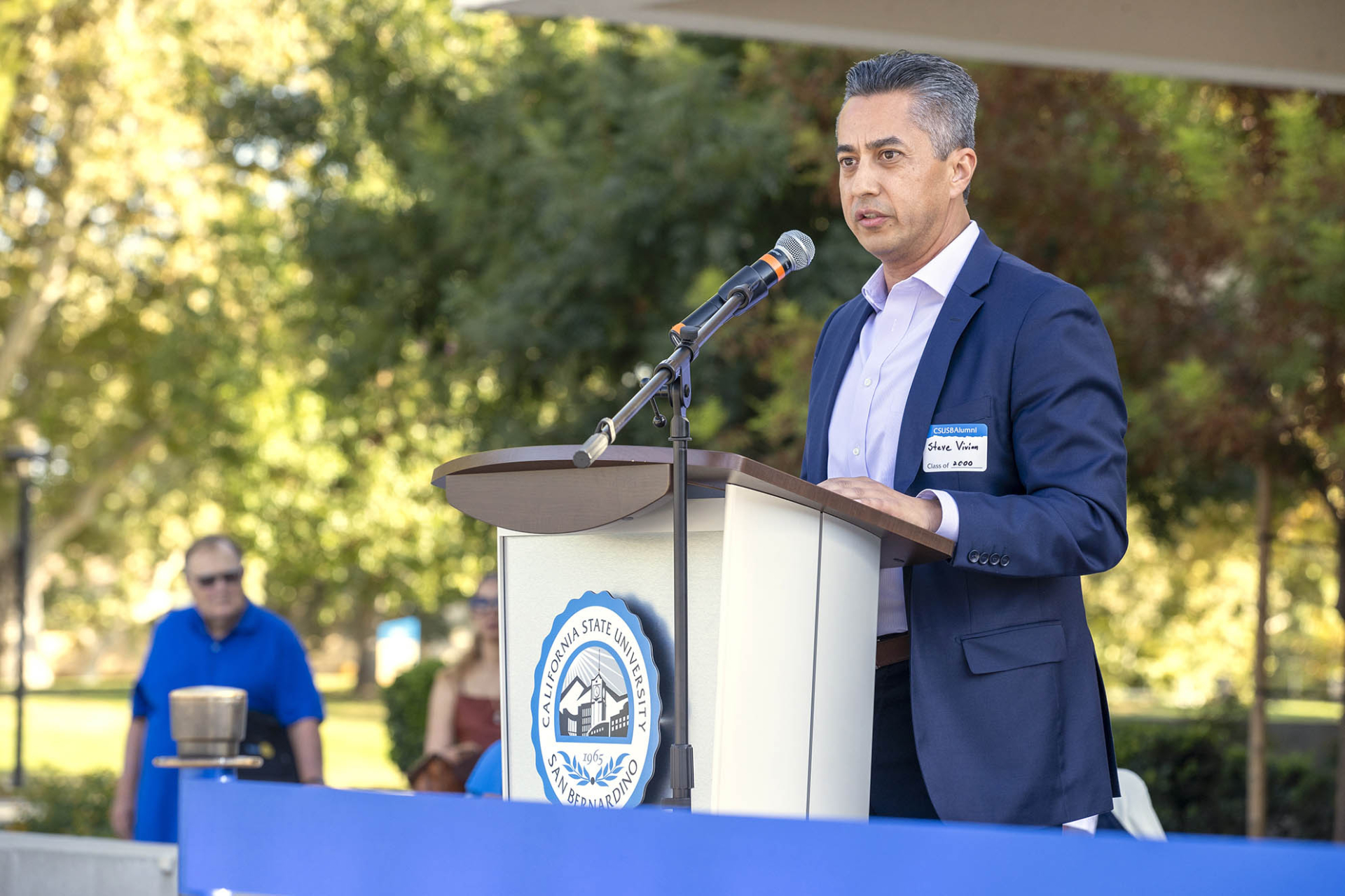 Steve Vivian speaks to the audience during the ribbon cutting for the CSUSB Alumni Center Sept. 18, 2024