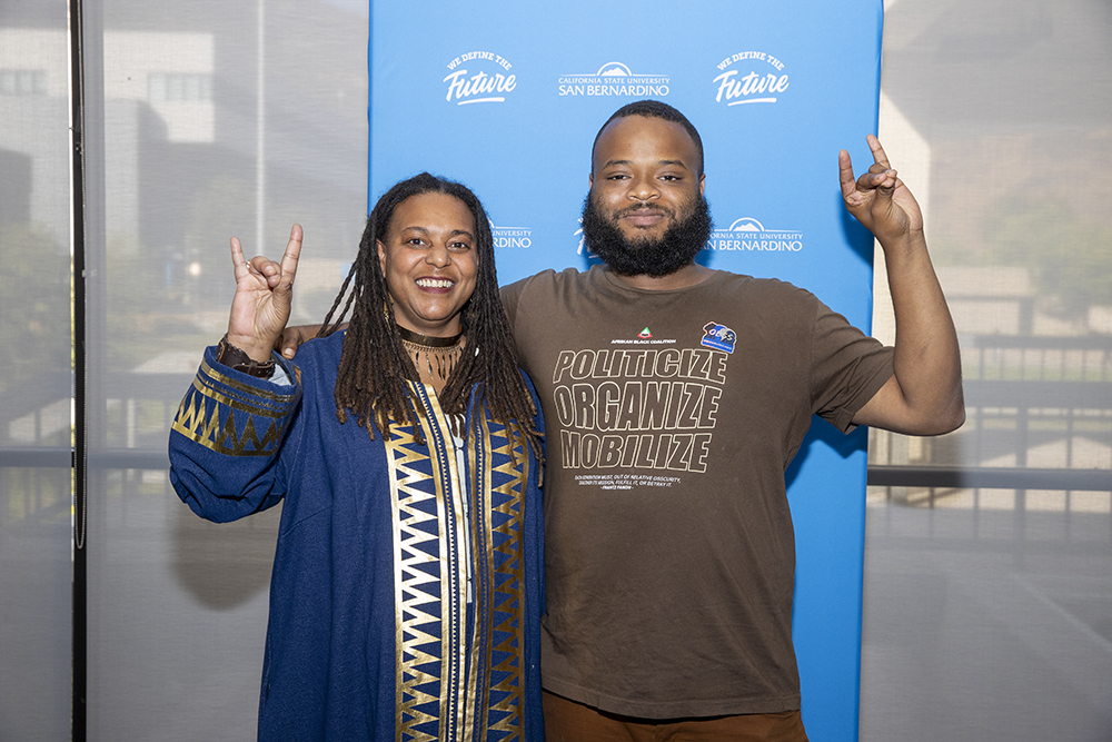 Papailler with her student Jalonis Taylor, a theatre arts major who spoke at the event and shared the positive impact she has had on his life.