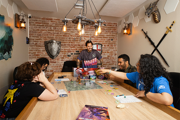 Graduate student Alberto Rendon observing game players during one of the 14 sessions he conducted as part of the research for his thesis.