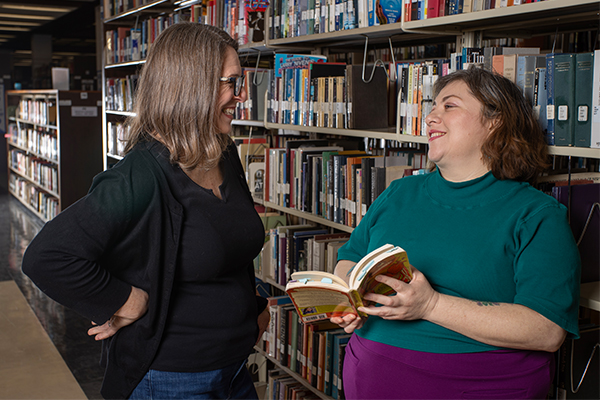 Author Isabel Quintero (right) talking with fan and Redlands East Valley High School librarian, Korrie Krohne.