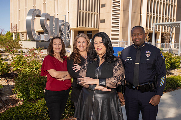 From left, CSUSB staff Jessica Chavez and Molly Riter, Kamel and University Police Department Chief John Guttierez