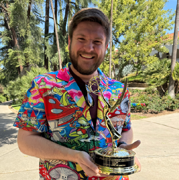 James Johnson holding an Award