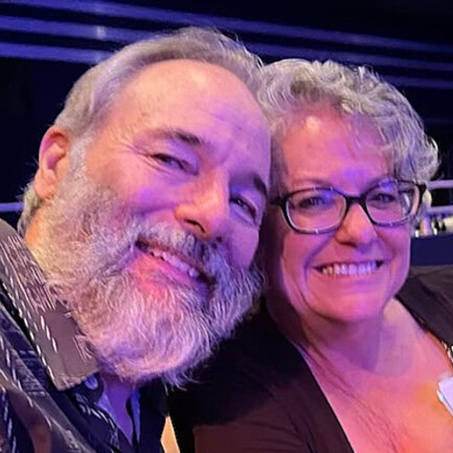 man and woman taking selfie
